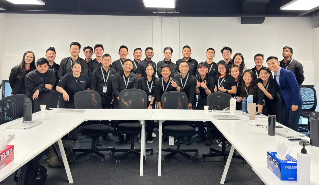 Lionel Lim conducting a professional grooming workshop for Tesla sales staff in Singapore